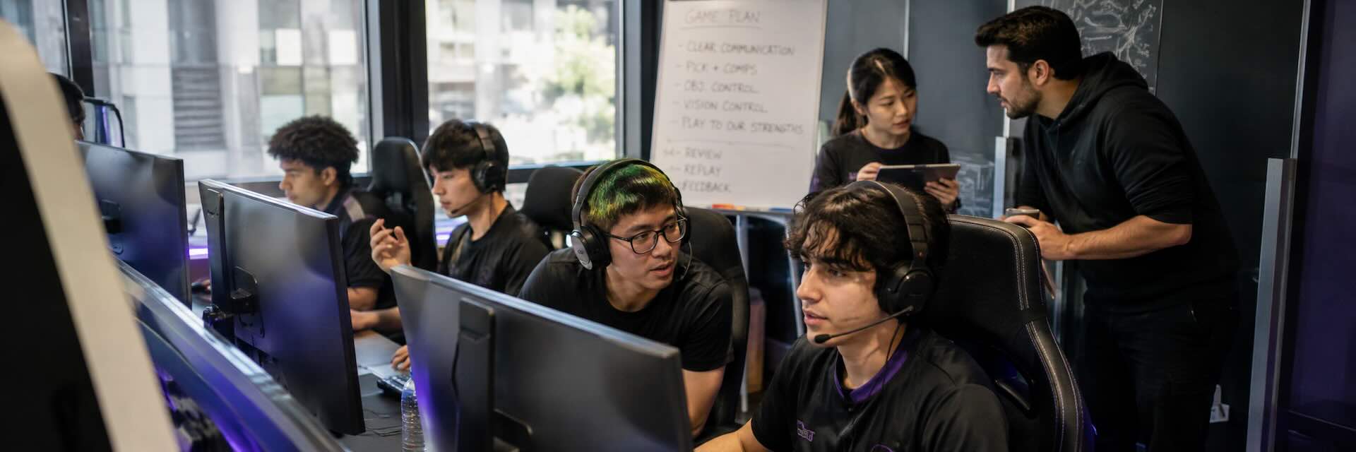 Documentary photograph representing the Gaming and eSports sector at work. Real setting, natural light, mid-activity.